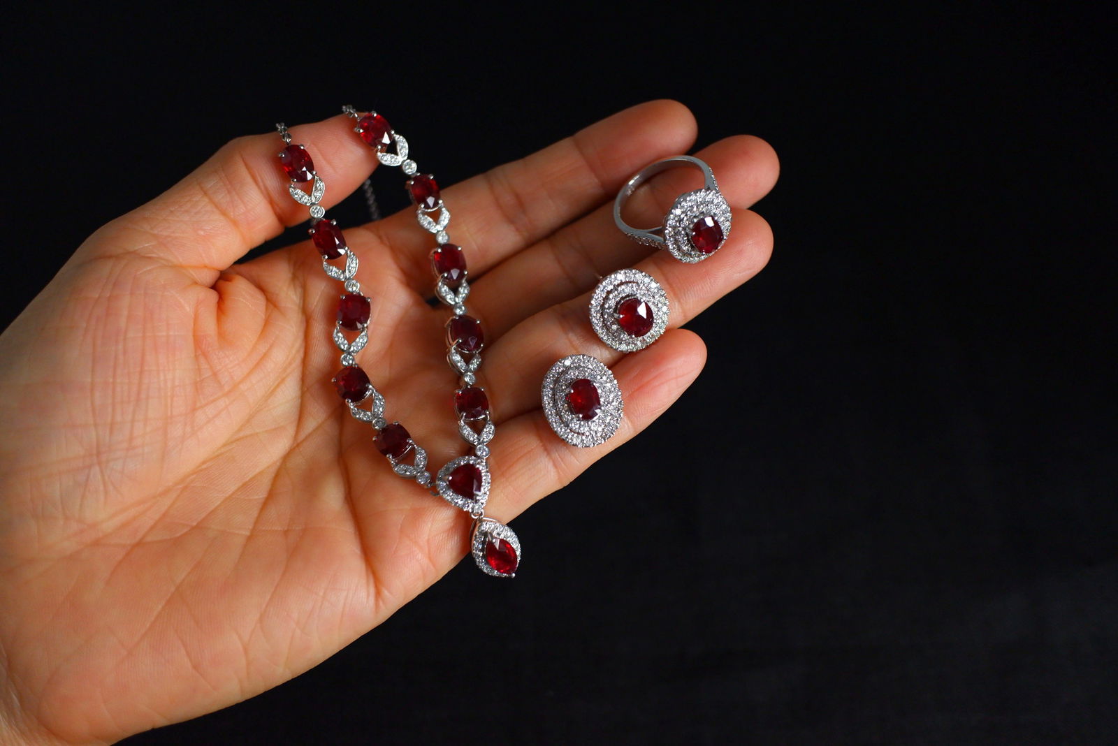 Gem Gardener, red ruby jewellery singapore, unheated ruby ring, ruby jewelry singapore, ruby necklace singapore, ruby earrings singapore, unheated ruby jewelry, ruby necklace singapore, pigeon blood ruby singapore, red ruby necklace and earring set, ruby diamond necklace set, ruby ring singapore, ruby cluster ring white gold, ruby halo diamond ring