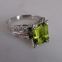 Gem Gardener, platinum peridot ring, peridot engagement ring, peridot ring white gold, peridot ring singapore, fine jewellery singapore, peridot ring with diamonds, burmese peridot ring