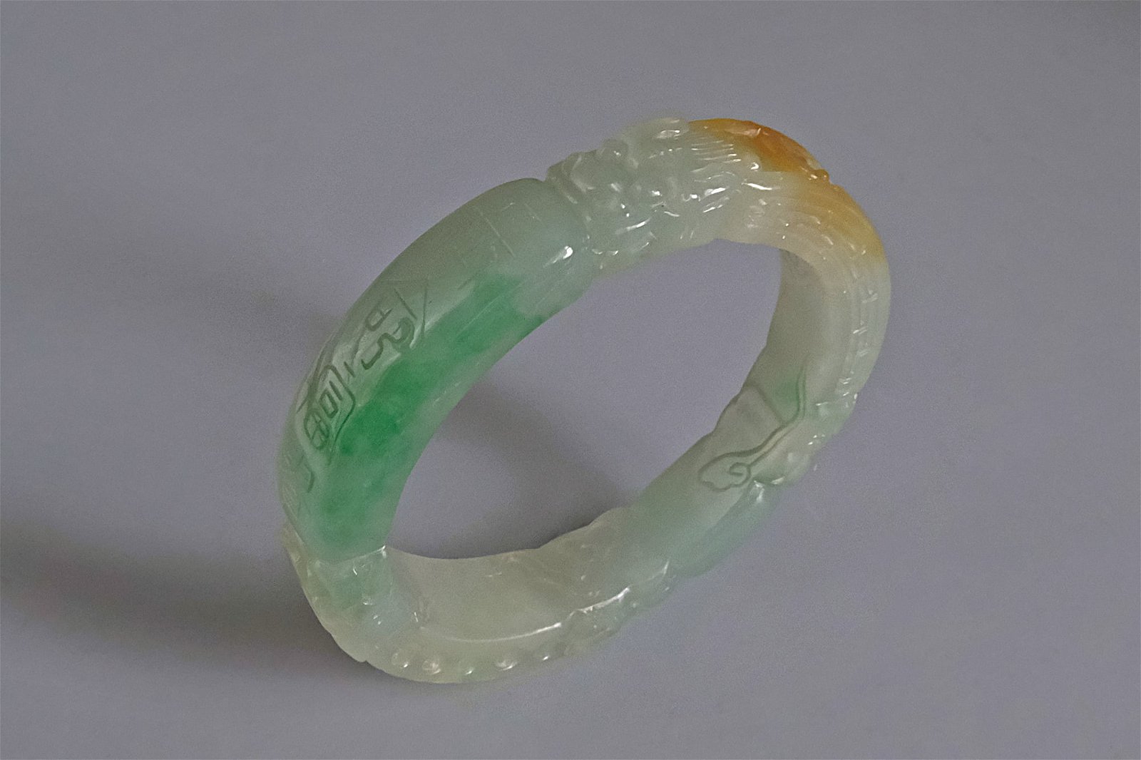 qing dynasty jade bangle, pale celadon jade bangle, dragon carved jade bangle, antique carved jade bangle, jade bangle singapore, Gem Gardener