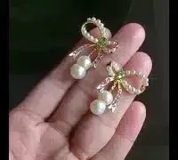 bow earrings yellow gold video